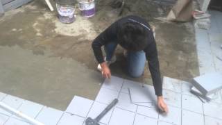 Ceramic floor tile installation process with sloping gradient [upl. by Couhp]