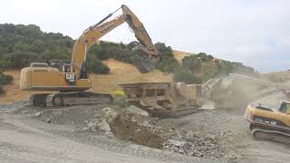 Cat 336F and 982 Feeding a crusher [upl. by Eceryt645]