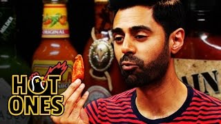 Hasan Minhaj Has an OutofBody Experience Eating Spicy Wings  Hot Ones [upl. by Dougall]