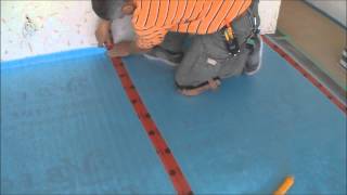 Installing the Underlayment for Laminate Flooring Installation on Wood Mryoucandoityourself [upl. by Kone]