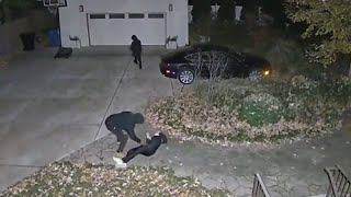 Surveillance video captures robbery outside Chicago home [upl. by Rayner]