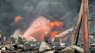 Firefighters douse flames after explosion at plastics factory near Bangkok  AFP [upl. by Warfourd]