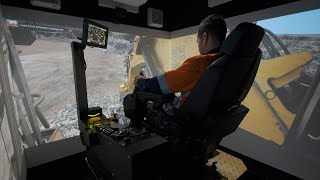 Operating the CYBERMINE CAT 6020B Excavator Simulator [upl. by Rani]