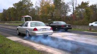 supercharged crown vic vs stock crown vic drag race [upl. by Valaree]