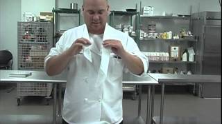 The Chefs Academy How to tie a neckerchief [upl. by Nnylaf582]