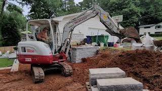 Building Keystone walls and grading drainage walkways with Takeuchi TB230 Mini Excavator Part 1 [upl. by Eioj588]