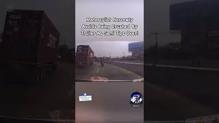 Motorcycle Rider Narrowly Avoids Being CRUSHED By Trailer As Semi Tips Over🏍️😮‍💨 ytshorts [upl. by Wexler]