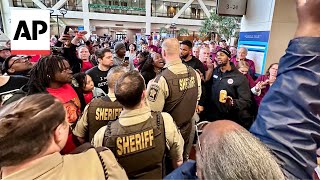 Dueling crowds rally at hearing for Minnesota trooper charged with murder [upl. by Refotsirhc304]