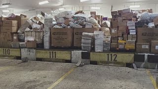 Photos show boxes of packages stacked up at Missouri City USPS Processing Center as delays continue [upl. by Everick310]