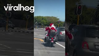 Santa Rides a Motorcycle Through Cape Town  ViralHog [upl. by Vins]