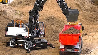 Huge RC Construction Site Wheel Excavator Trucks Fire Engines  Modellbaumesse Friedrichshafen 2024 [upl. by Aniv]