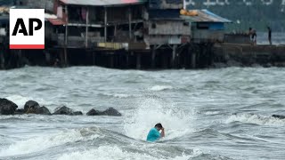 Floods in Philippines kill at least 9 and trap others on roofs [upl. by Nuawd989]