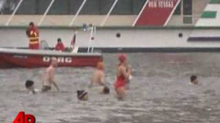 Raw Video German Swimmers Take New Years Swim [upl. by Hairehcaz898]