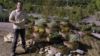 Build up your slope if needed then install hillside planters as a retaining wall alternative [upl. by Slocum]