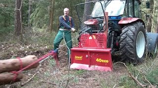 Steyr 370 Kompakt mit Uniforest Seilwinde beim Holz rücken winching firewood with a forestry winch [upl. by Lolly202]