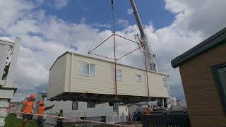 Chesil beach holiday park crane lifting caravans into place [upl. by Imij]