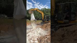 excavatorfunny bentonite bag ripping on the pond install equipmentfail [upl. by Yeroc]