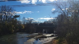 an eastbound manifest crossing the Elkhart river in Goshen [upl. by Sanfourd]