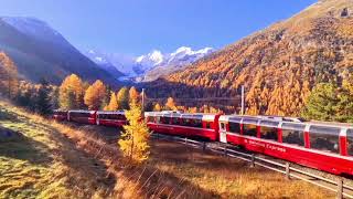 Trenino Rosso del Bernina sale tra panorami autunnali [upl. by Ralaigh]