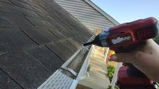 Installing Waterlock gutter protectors on the house [upl. by Trautman]