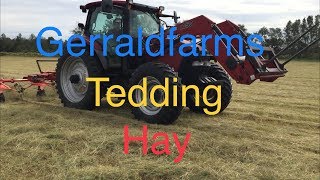 Gerraldfarms Tedding with Case maxxum 125 and Kuhn 5001 [upl. by Cerf]