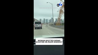 Woman rides scooter on Miami highway [upl. by Noam]