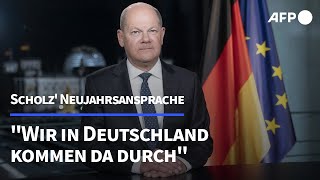 Scholz in Neujahrsansprache quotWir kommen da durchquot  AFP [upl. by Ahswat]