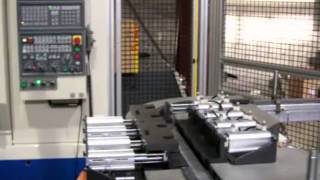 Fanuc M16iB Robot Loads a Pair of Okuma VMCs [upl. by Aicelet]