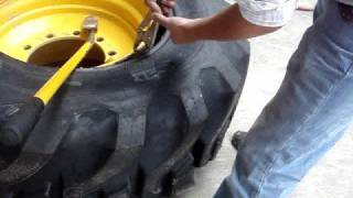 Backhoe tire dismounting 195 L24 [upl. by Ettezil]