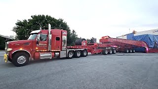 Trans American Peterbilt 567 Hauling Stator Gross 487000 Lbs 23 Axles 235 ft Long Kenworth Pusher [upl. by Nailil882]