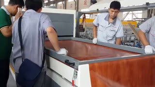 wpc door panel laminating machinelaminate film on door panel surface [upl. by Eerdna918]