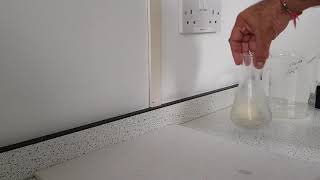 Using atmospheric pressure to push an egg into a conical flask [upl. by Sidonia515]