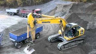 Komatsu PC 290 LC excavator loading a truck w trailer [upl. by Garek]