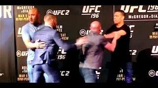 Conor McGregor and Nate Diaz Scuffle at UFC 196 FaceOffs [upl. by Nosiddam]