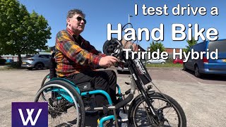 I test drive a hand bike hybrid power Triride wheelchair front wheel attachment [upl. by Rednasyl]