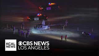 Police close 110 Freeway in South Los Angeles after a helicopter lands in the express lanes [upl. by Sitnerp]