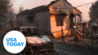 Residents in Greece return to damaged properties after wildfire  USA TODAY [upl. by Ailehc]