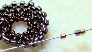 How to Seed Bead Around a Crystal Rivoli Stone Using Circular Peyote Stitch [upl. by Brott85]