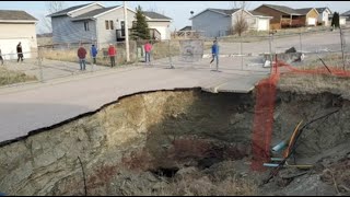 Giant sinkholes in a South Dakota neighborhood make families fear for their safety amp More [upl. by Sicard]