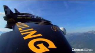 Daredevil Jetman Yves Rossy soars over Alps in wingsuit [upl. by Horacio]