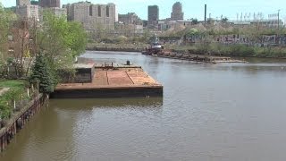 Noon Barge raised in Cuyahoga River [upl. by Airdnaed]