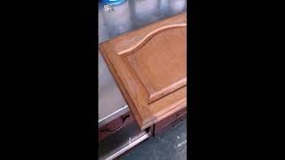 Spraying Renner 643 on an old oak cabinet door [upl. by Atsed]