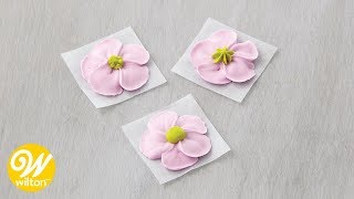 How to Add a Center to Icing Flowers  Wilton [upl. by Zondra]