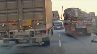 Transporter movie style car cruising in between trucks Mahindra Vs mazda engine coach van Overtake [upl. by Bill624]