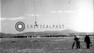 A sailor hanging on a cable attached to USS Akron in flight over Camp Kearny SanHD Stock Footage [upl. by Elleinaj411]