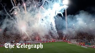 Fans shoot fireworks on football pitch in Argentina to delay game [upl. by Loredo]