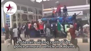 Protesters seizing control of a police armored vehicle in Kadunapoliceprotestkadunanigeria [upl. by Nomzzaj222]