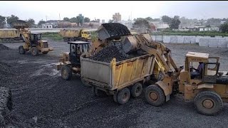 New Cat 980M Wheel Loader Loading Volvo C FH13 Semi Trucks [upl. by Laraine]