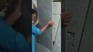 Tile a wall properlyviralyoutubeshorts youtubeshorts tileinstaller tilefixing [upl. by Dowell160]