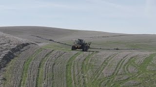 Tractor sliding and spraying hillsides sideways [upl. by Ramey197]